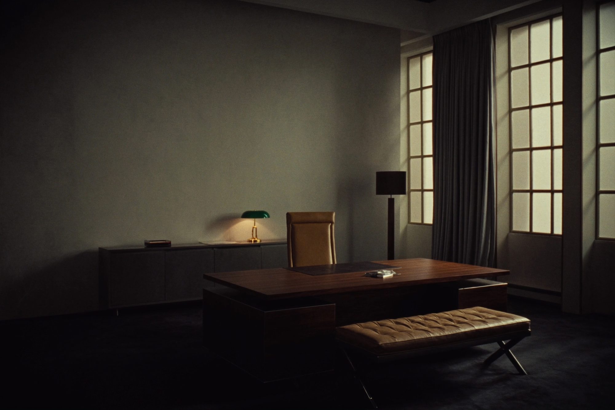 Private executive office with a walnut desk and leather chair